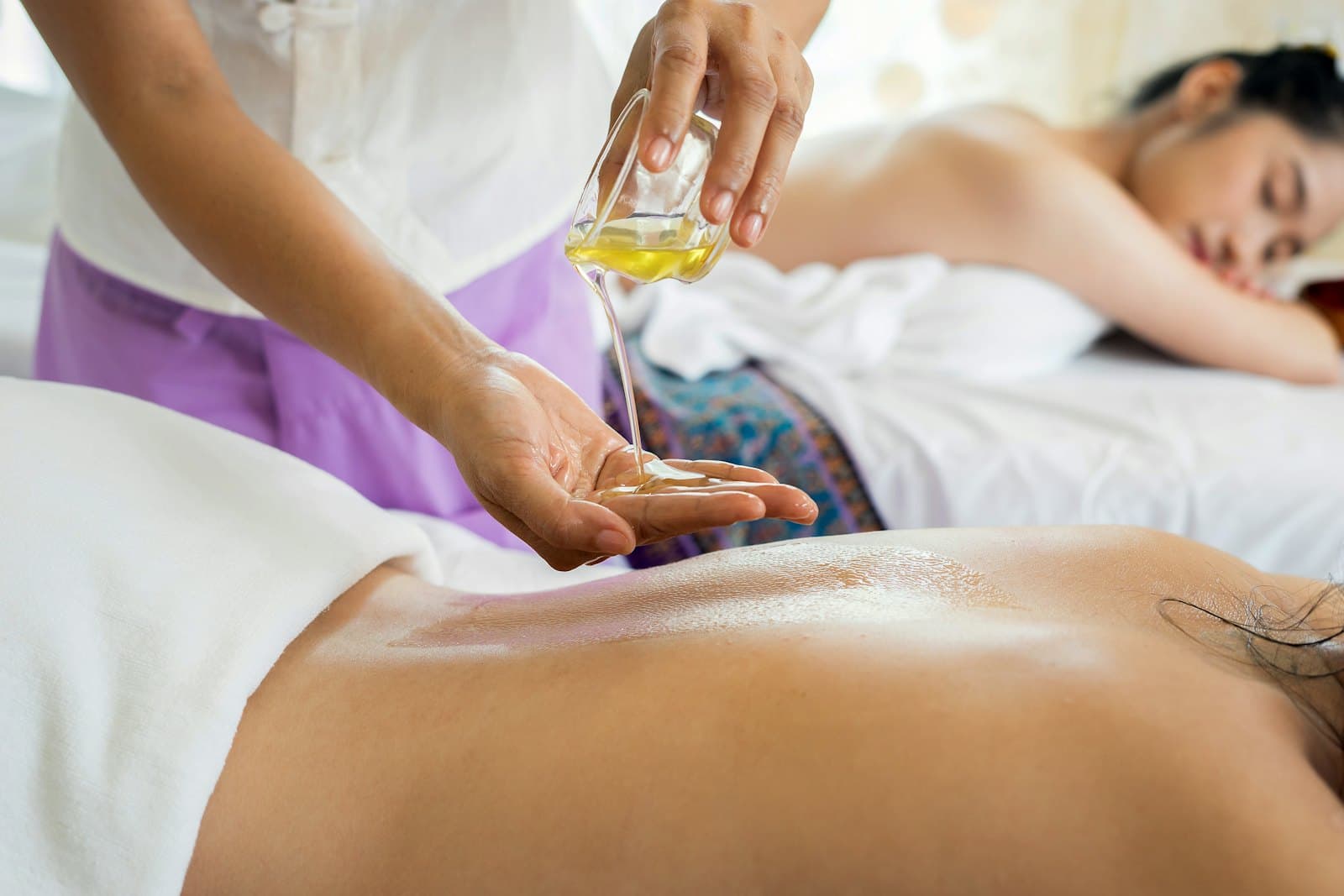 Spa therapist preparing an oil treatment